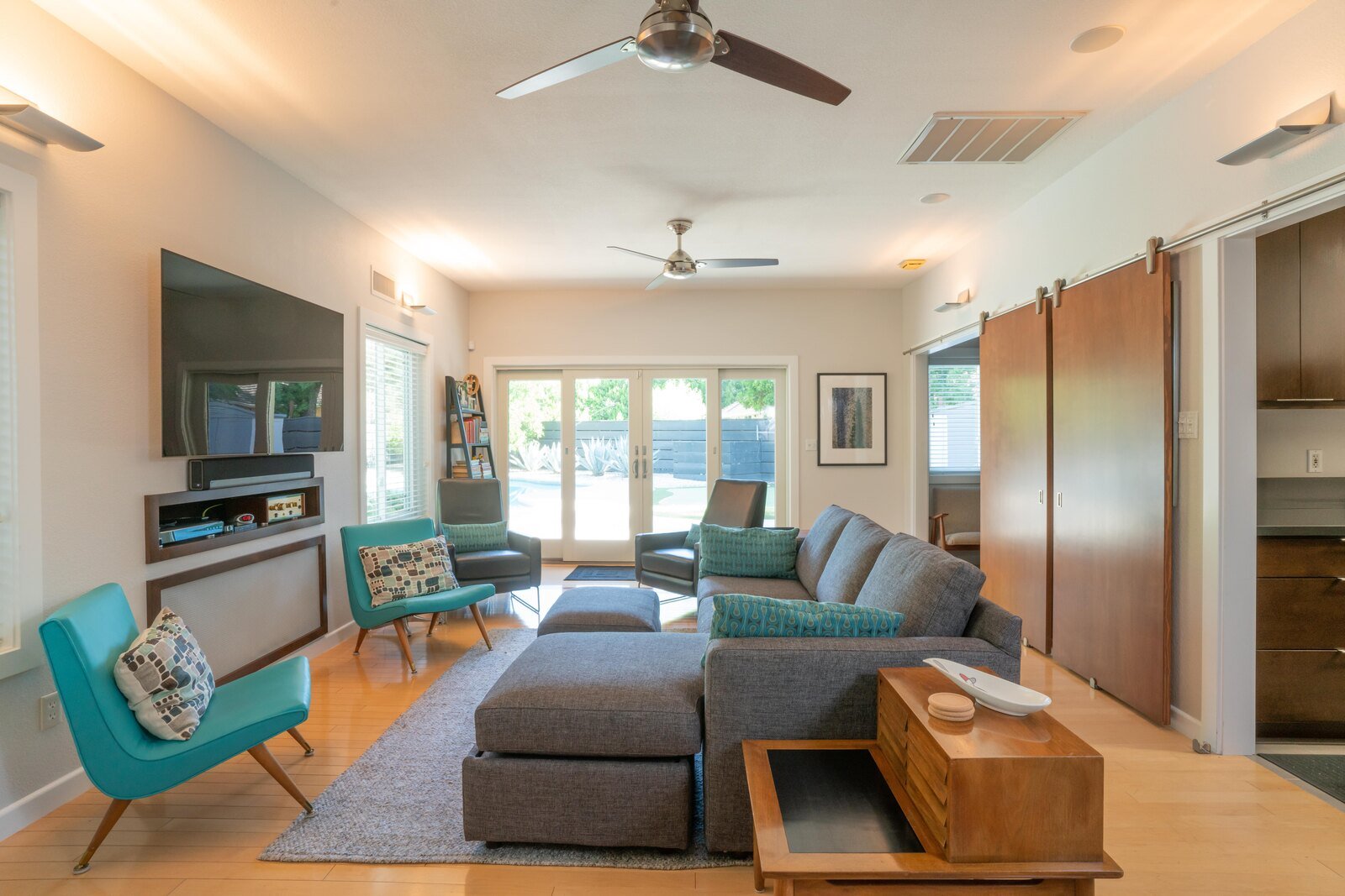 Fresno, CA living room design with couches and chairs by Imagine Remodeling