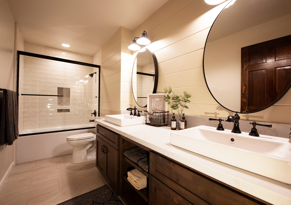 Fresno, CA bathroom remodel with double vanity and black fixtures by Imagine Remodeling