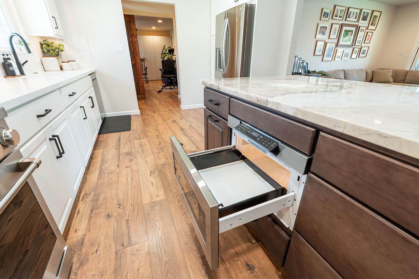 Modern Clovis, CA kitchen featuring a marble island countertop and built-in microwave drawer Modern Clovis, CA kitchen featuring a marble island countertop and built-in microwave drawer
