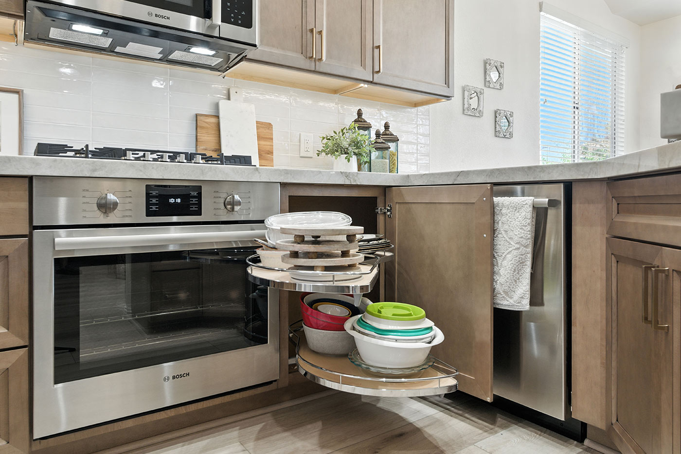 Corner cabinet pullout organizer in a Fresno kitchen remodeled by Imagine Remodeling for smart storage solutions