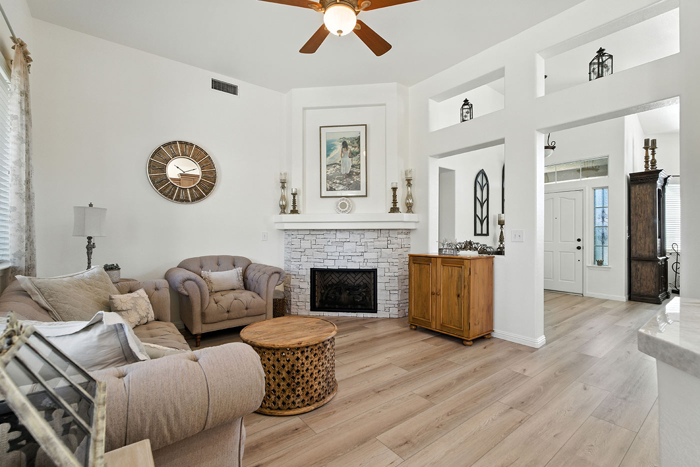 Refined Fresno home interior by Imagine Remodeling with soft décor and a welcoming fireplace centerpiece